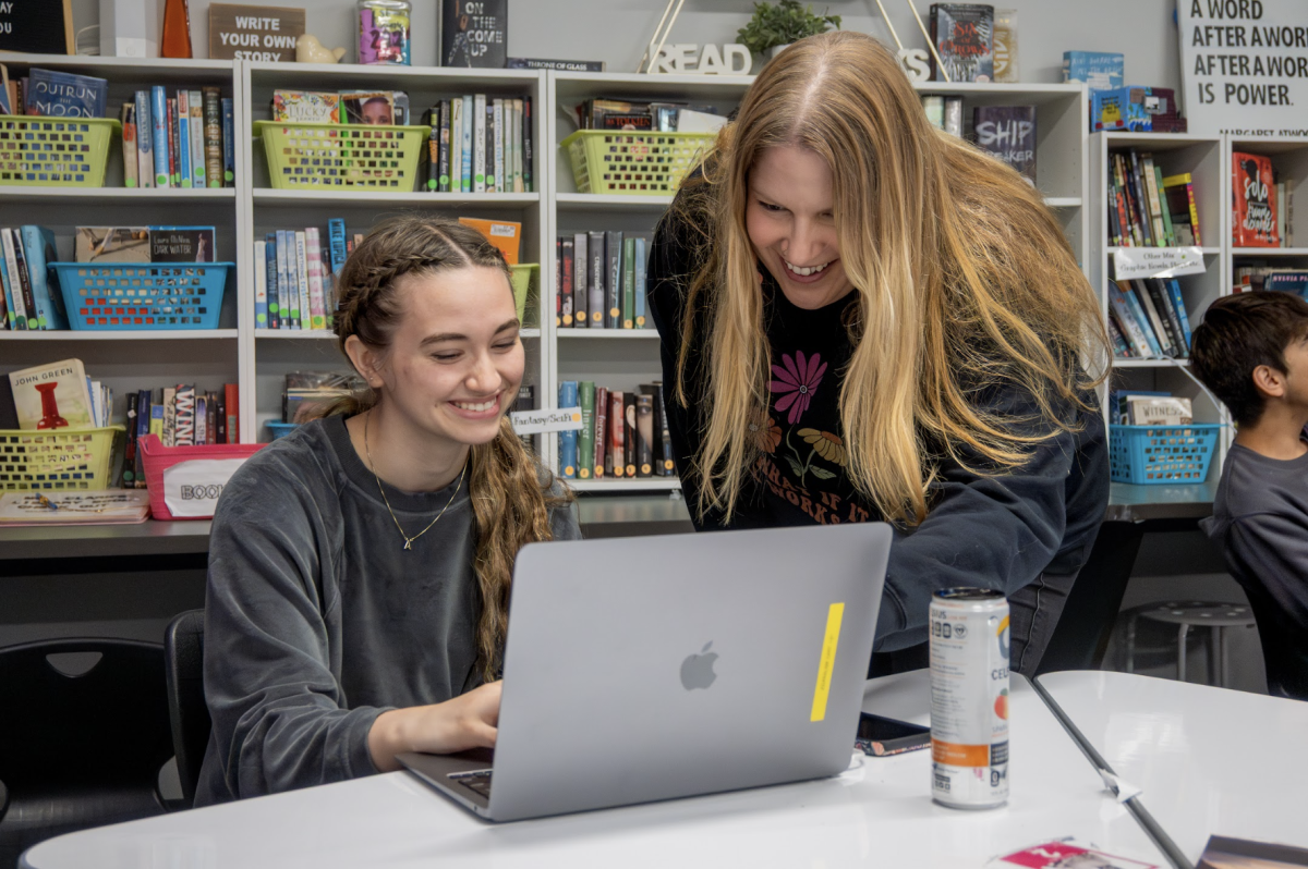 During work time, English teacher Josie Clark helps junior Katie Campbell, her teacher aide. 
